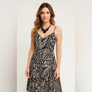 Bella , animal print dress with straps, black and white color, new without tag.